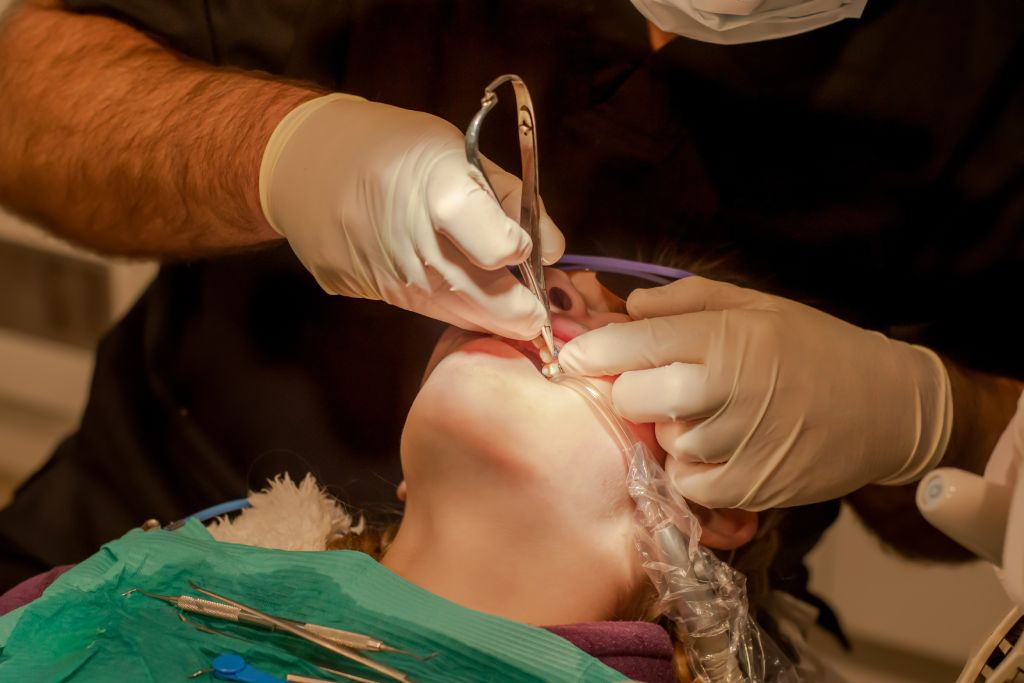 orthodontist put on metal braces orthodontic treatment